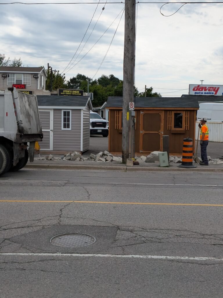 Who Is Paying for Oshawa Sidewalk Work on Bloor Street East? Skid-steer working beside orange markings on a Bloor Street East sidewalk in Oshawa